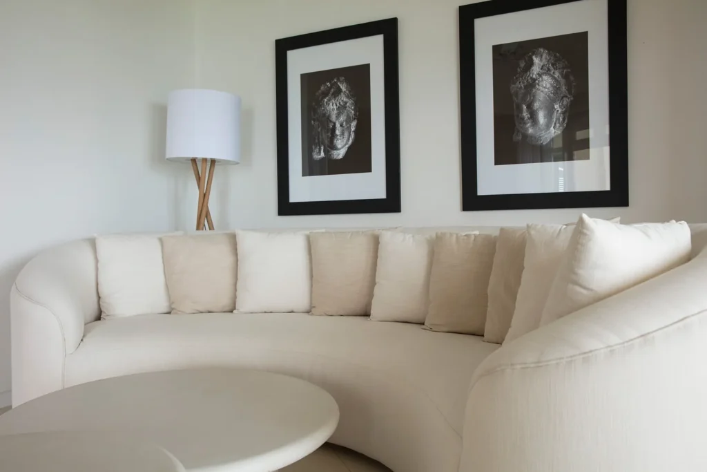 Curved lounge in an Ocean Suite by The Lux* Collective