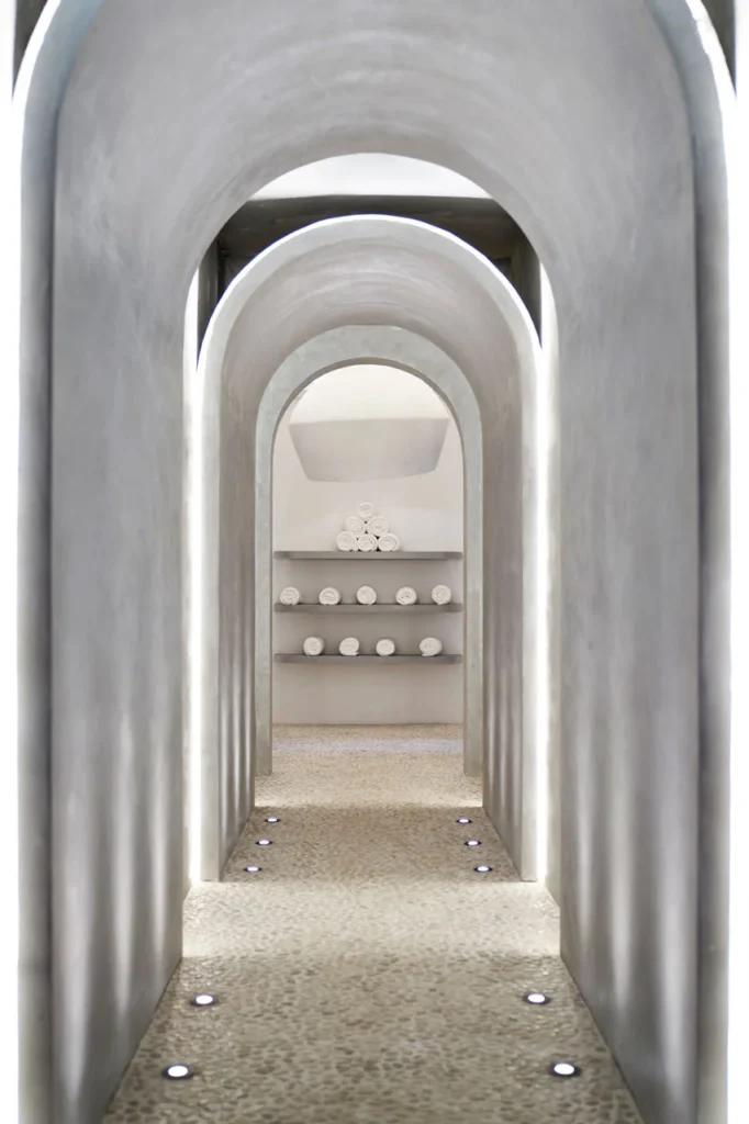 Vaulted corridor in a wellness space by The Lux* Collective