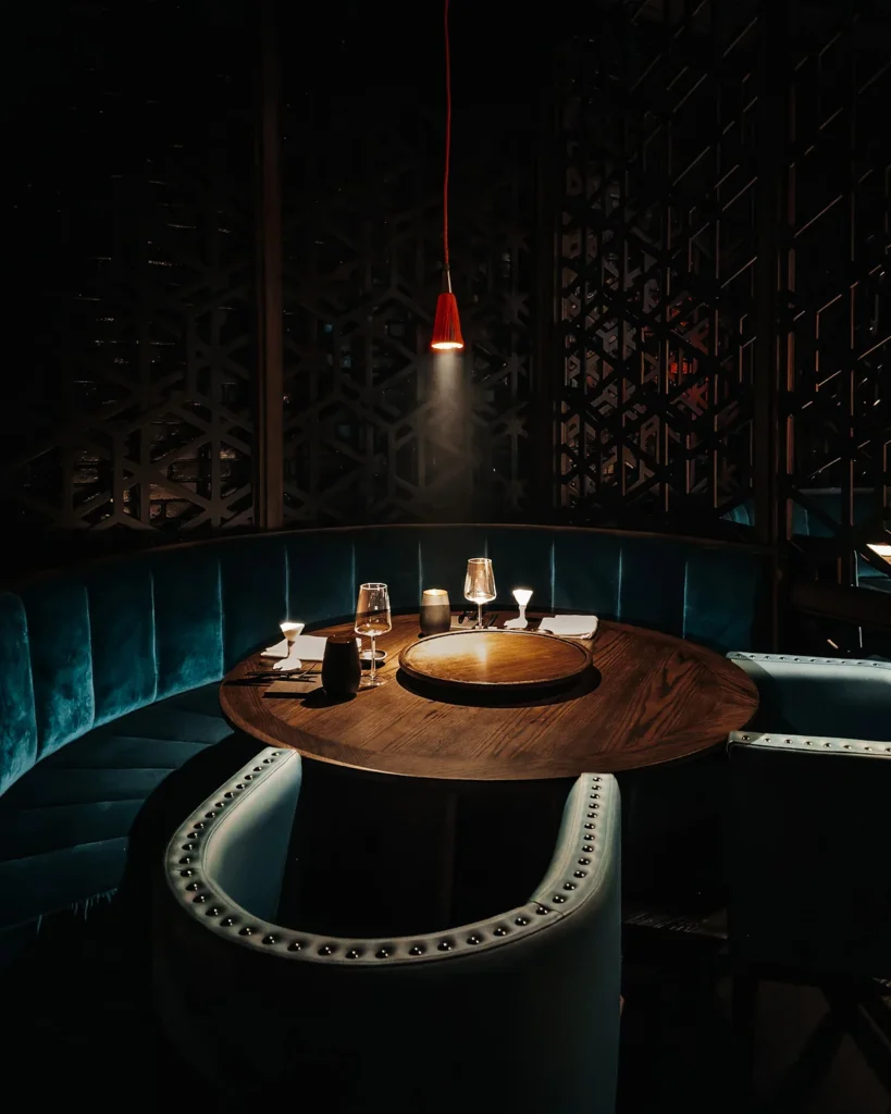 Round table in a dining space by The Lux* Collective