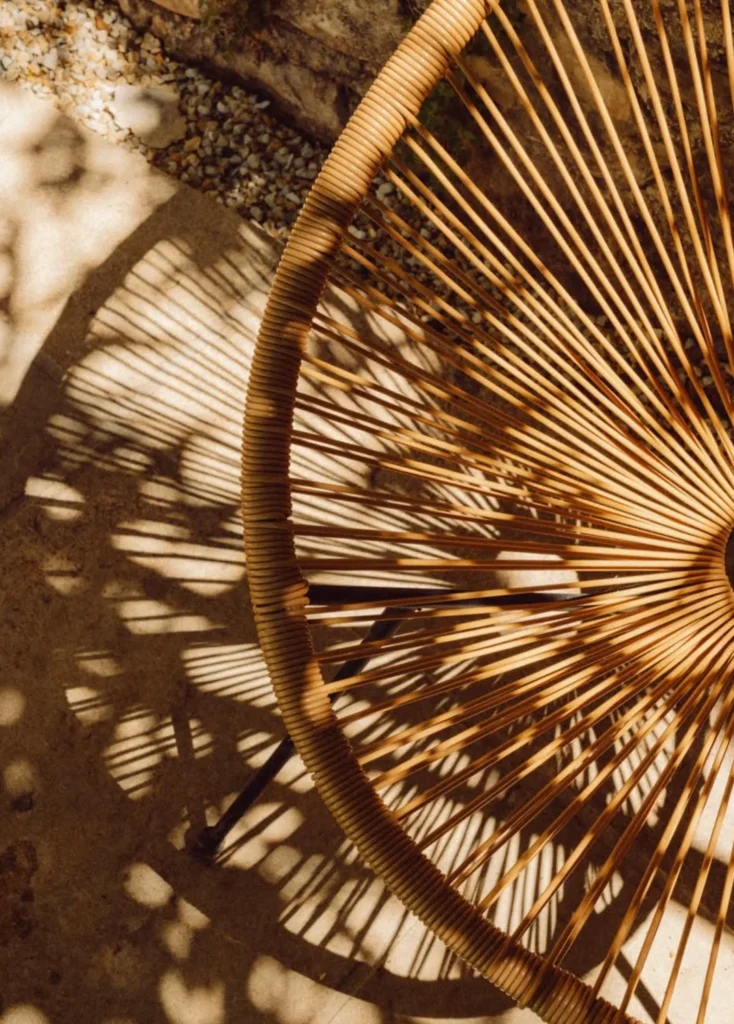 A chair at Pantoufle Hôtel crossed by shadows