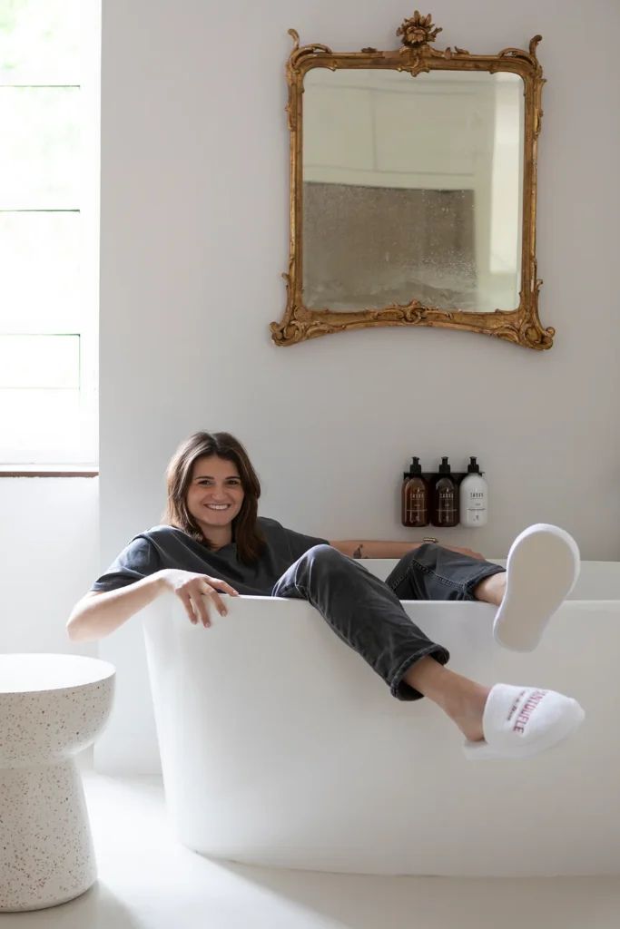 Jeanne Jouvet in a bathtub at Pantoufle Hotel in Marsanne